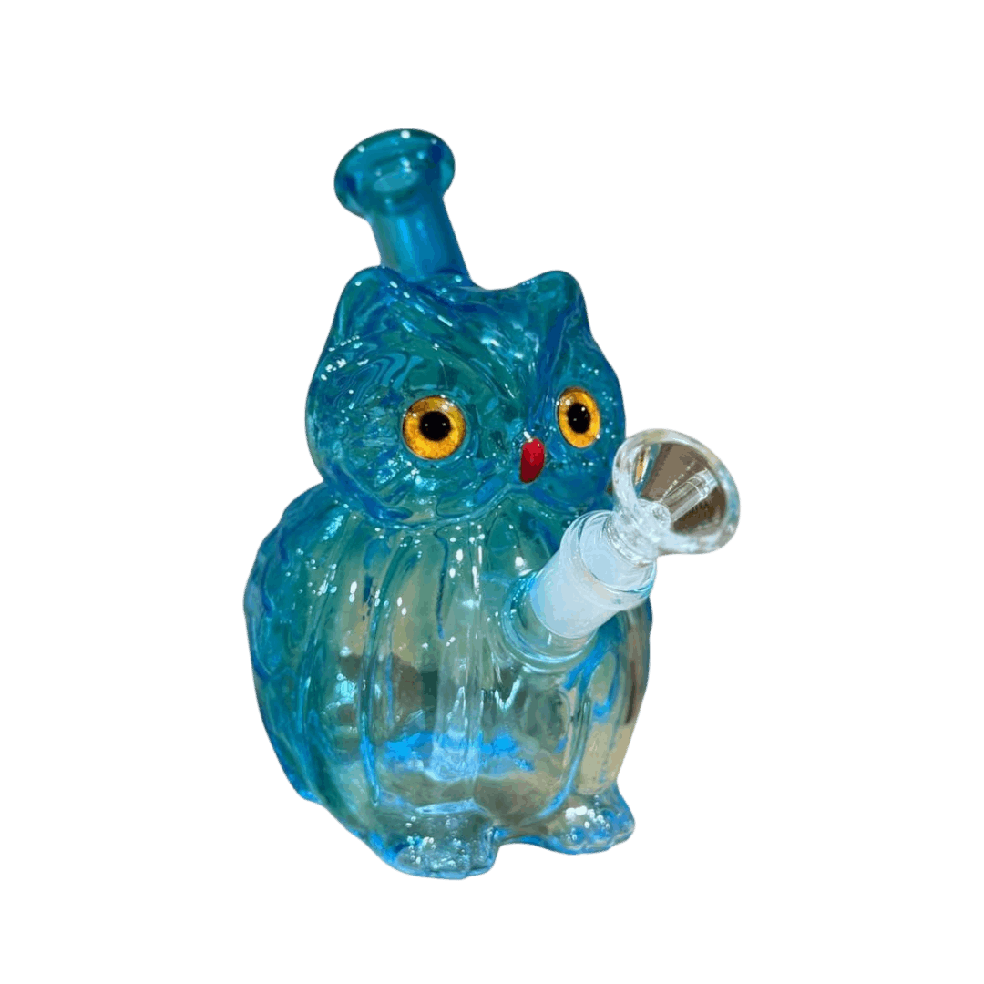 Blue glass owl-shaped smoking accessory on a white background