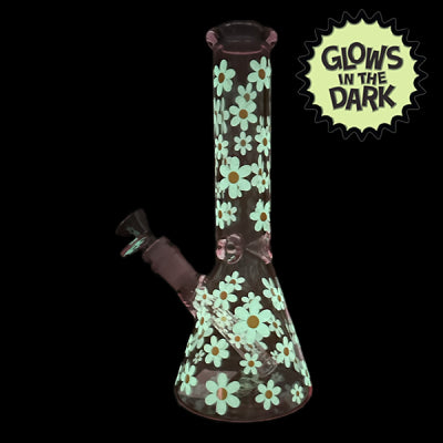 This image displays the Glow in the Dark Marc Jacobs Daisy Pink Beaker, measuring 25cm in height. The beaker features a vibrant pink color, decorated with a delightful floral pattern in shades of orange and yellow.