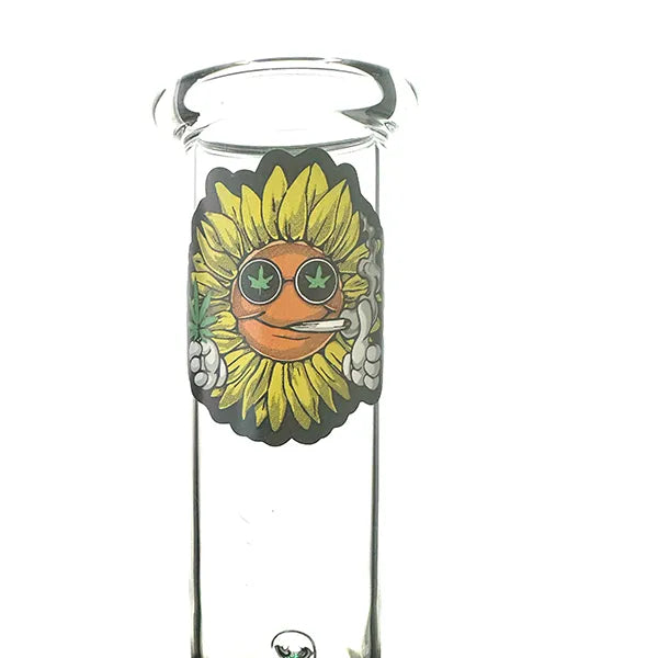 A clear glass stoner bubble with a decorative sunflower design on it, featuring a green base and a black stand.