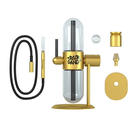 A black and gold Stündenglass X Wiz Khalifa Taylor Gang Gravity Infuser, a sophisticated 360° rotating glass smoking device with a gold base and black accents.