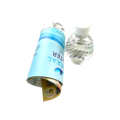 Water filter cartridge next to a clear water bottle on a white background