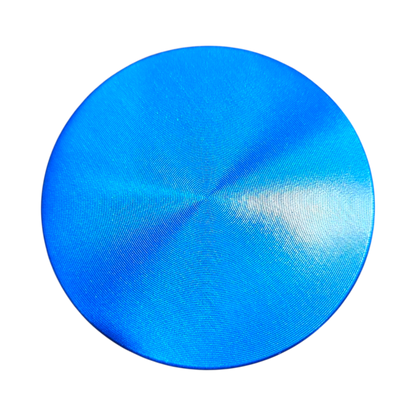 Blue circular object with a textured surface on a white background
