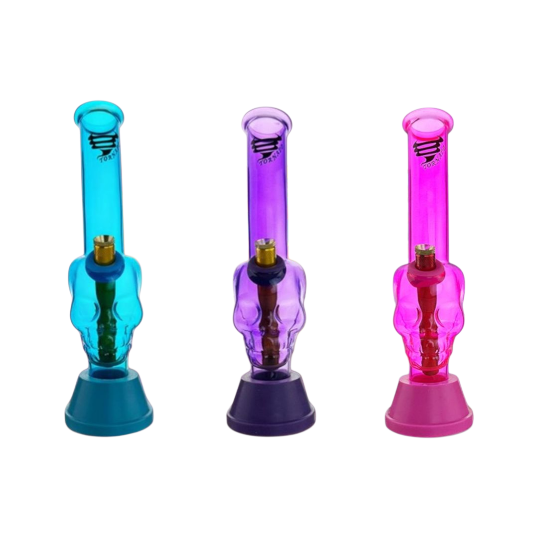 Three colorful skull-shaped bongs in blue, purple, and pink on a white background.