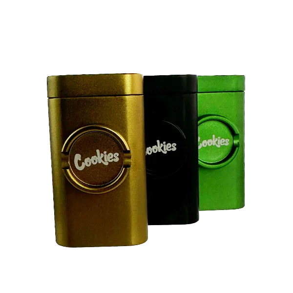 Three metal containers with 'Cookies' branding in gold, black, and green on a white background.