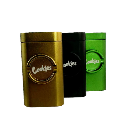 Three metal containers with 'Cookies' branding in gold, black, and green on a white background.