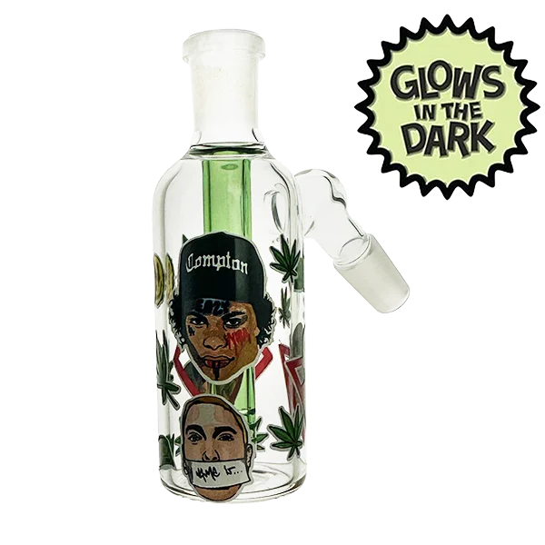 Glass smoking device with artistic design and 'Glow's in the Dark' label on a white background