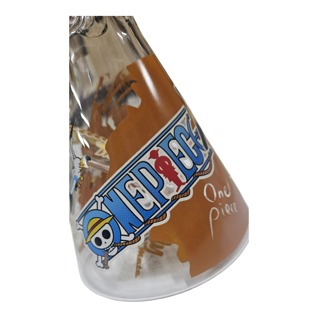A clear glass conical glass with a One Piece 'One Piece' decal and a brown pirate flag design, shown on a white background.