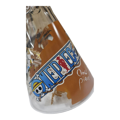 A clear glass conical glass with a One Piece 'One Piece' decal and a brown pirate flag design, shown on a white background.