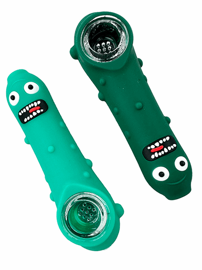 Two green silicone smoking pipes with face designs on a white background