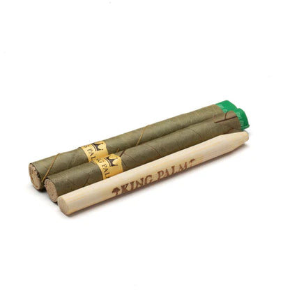 Two King Palm rolling papers with a green tip on a white background