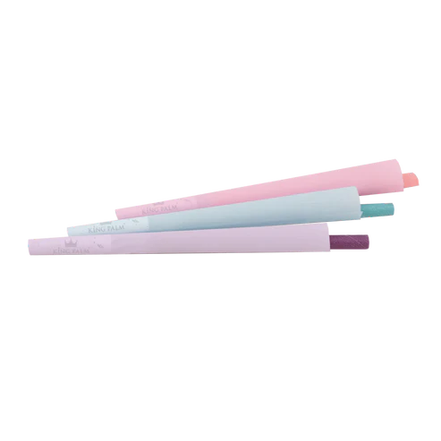 Three pastel-colored rolling pins stacked on a white background