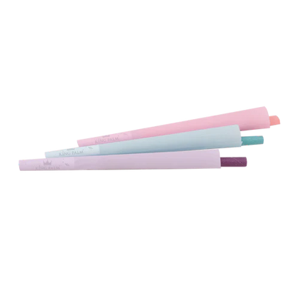 Three pastel-colored rolling pins stacked on a white background