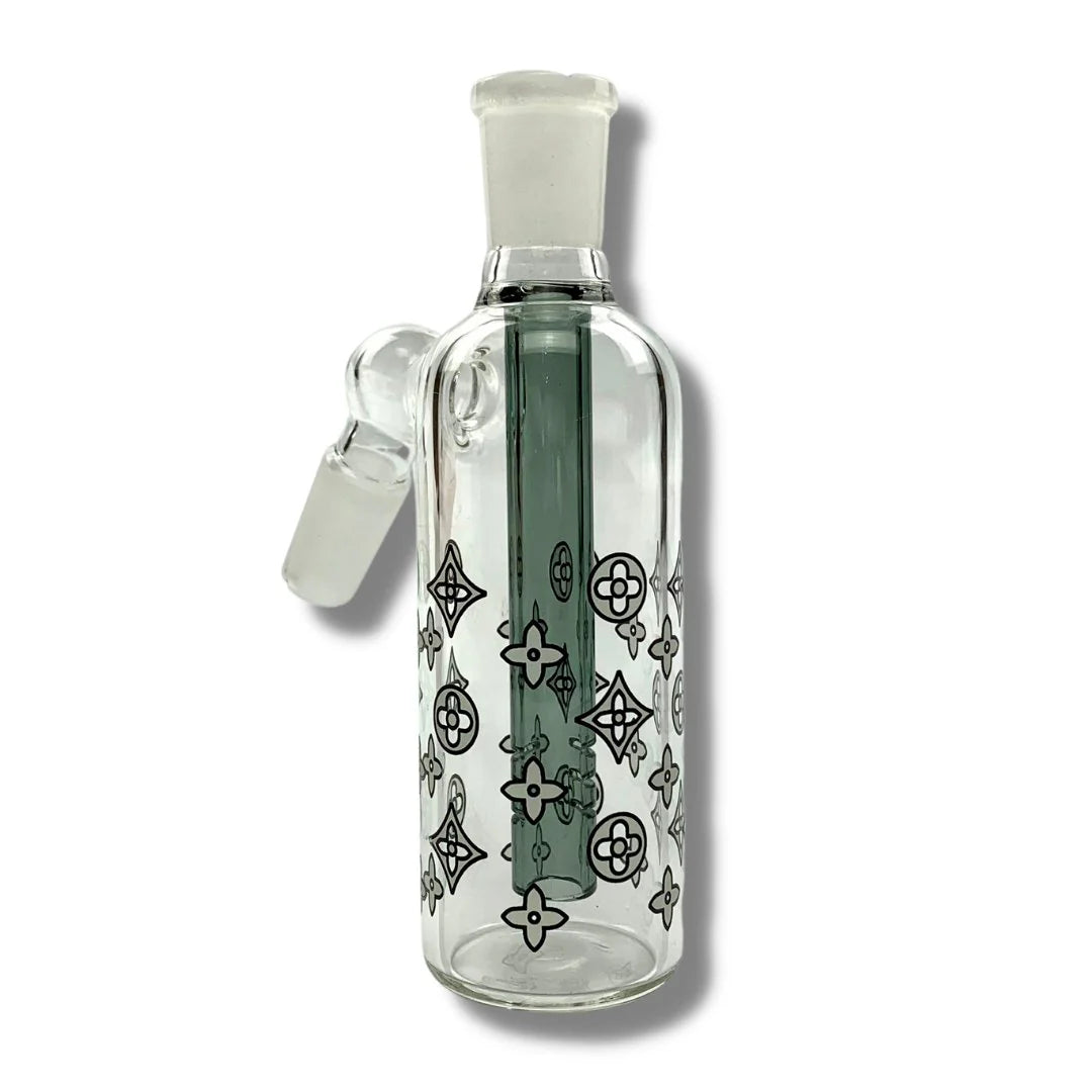 Clear glass bottle with decorative patterns on a white background