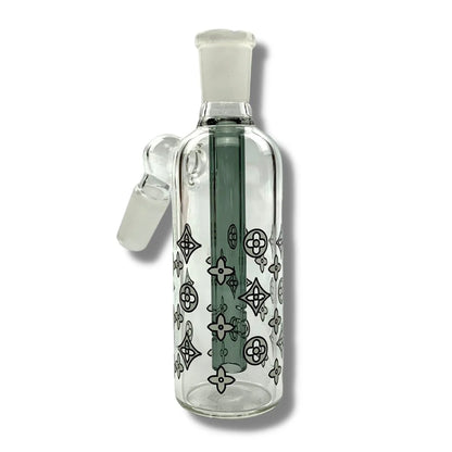 Clear glass bottle with decorative patterns on a white background