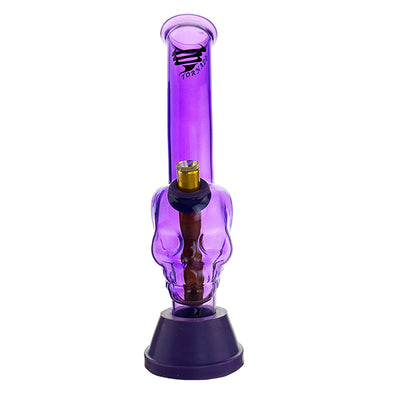 A purple silicone bong with a skull design and a silicone base.