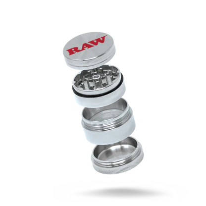 A four-piece RAW brand grinder with a silver color and the RAW logo on the top cover.
