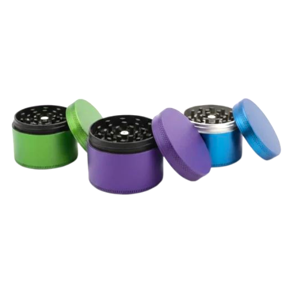 Set of five colorful metal grinders on a white background