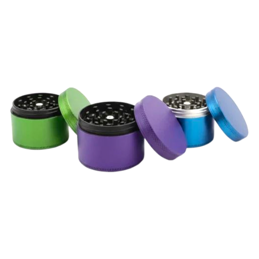 Set of five colorful metal grinders on a white background